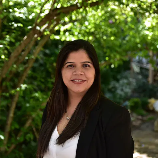 Portrait of Bhavika Unnadkat, Mentor(SHE:) Program Lead, with a natural outdoor background.